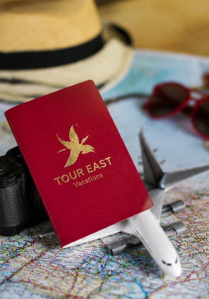 Travel essentials - passport, hat and plane